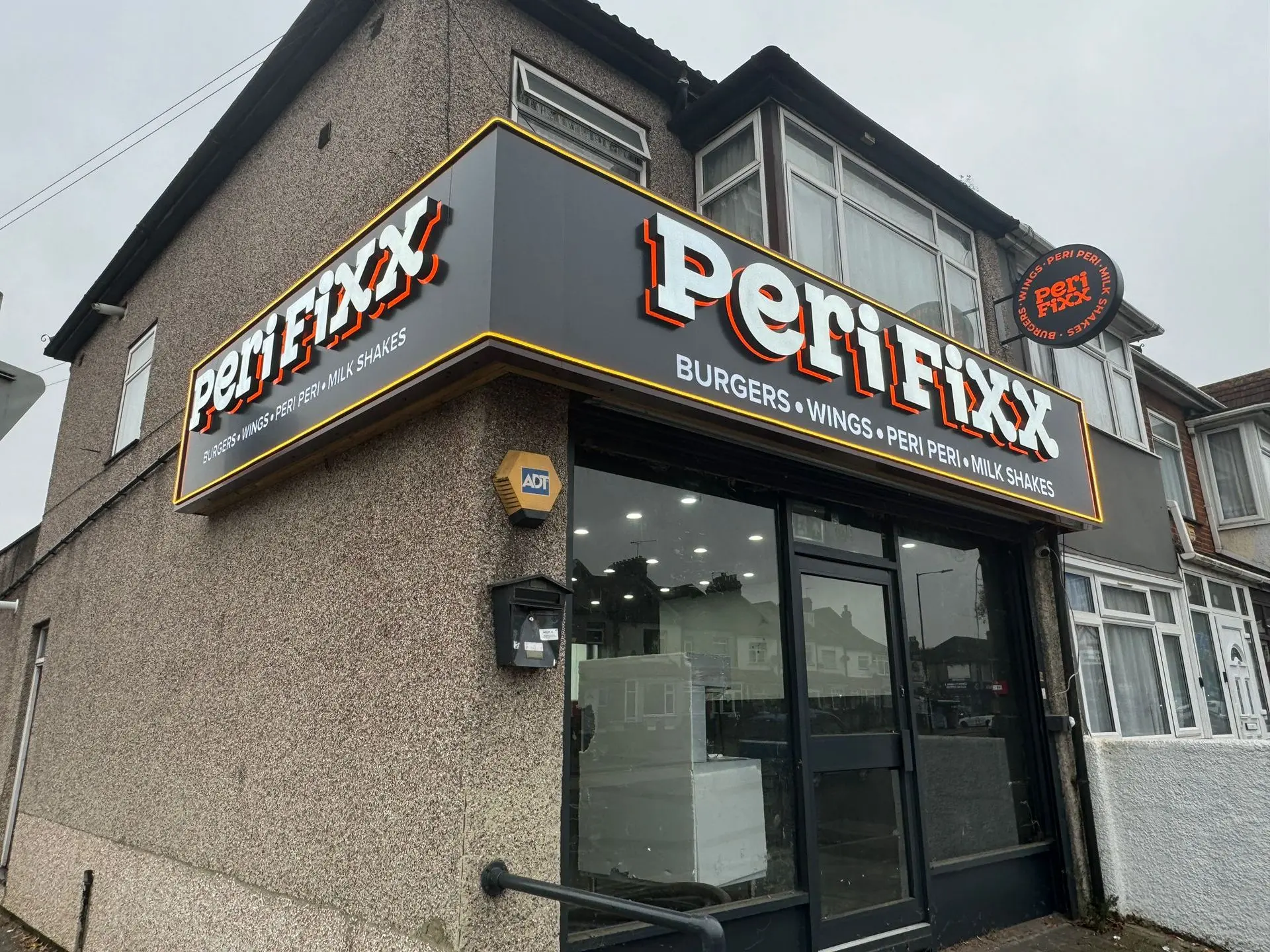 Custom sign design for Perfixx featuring bold and eye-catching branding