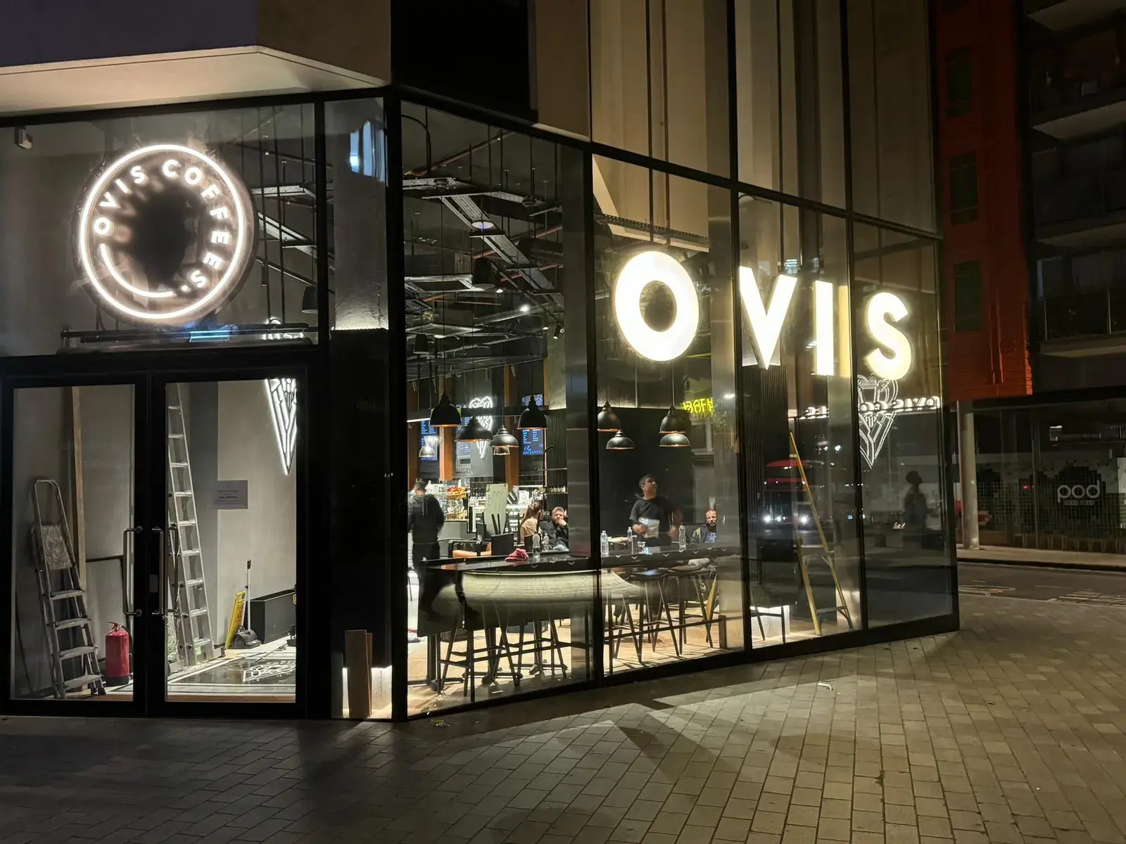 Illuminated signage for Ovis Coffee Shop highlighting LED and neon lighting solutions