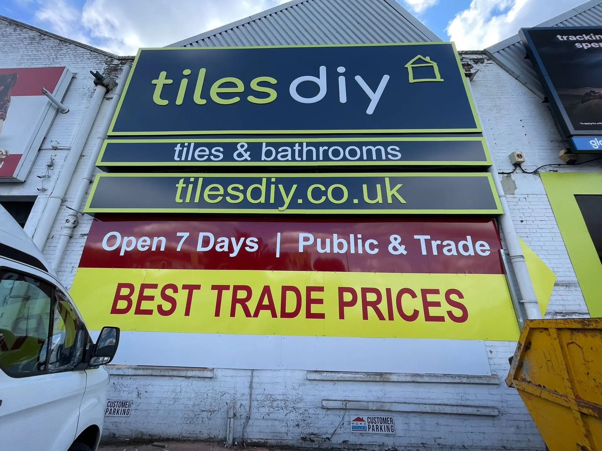 Colourful promotional banner for Tiles DIY highlighting trade prices and offers