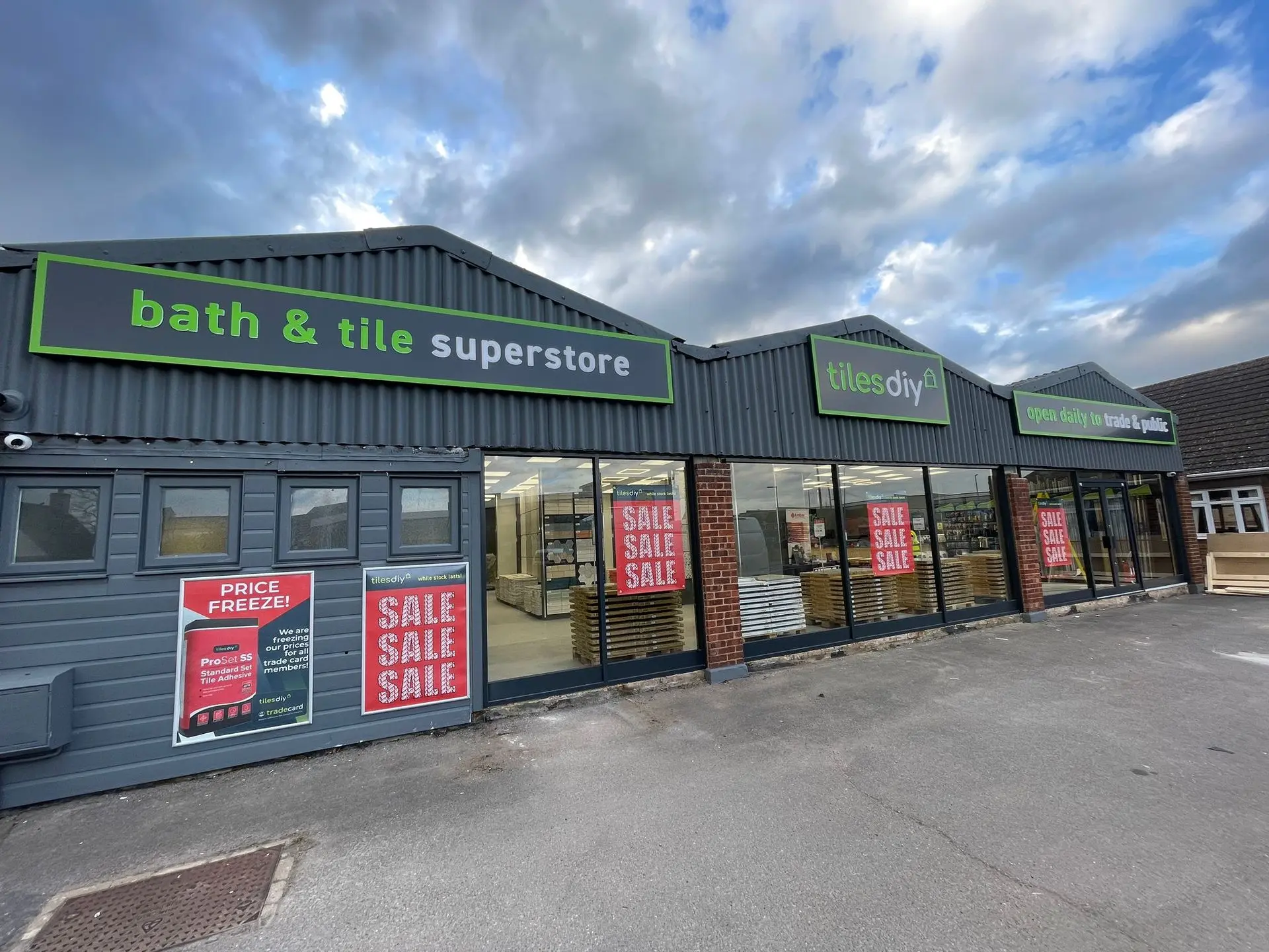 Custom storefront signage for Bath & Tile Superstore, designed to stand out on the high street.