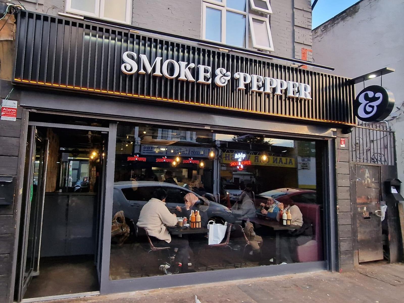 Exterior signage for Smoke & Pepper showcasing a modern and stylish storefront design