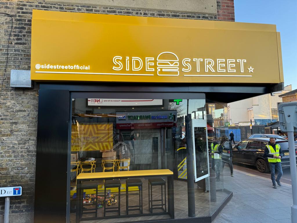 Custom storefront signage for Side Street featuring bold and vibrant branding